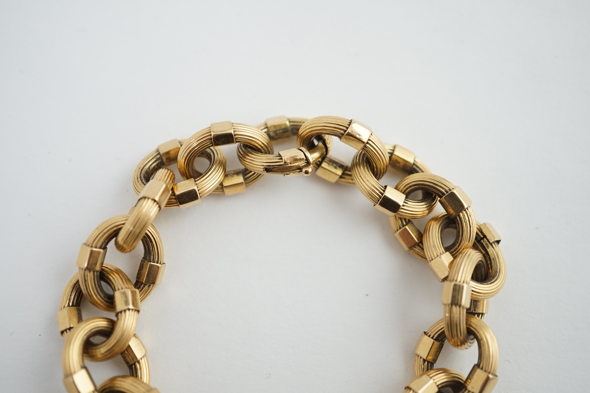 A late 20th century Italian 18k gold reeded oval link bracelet